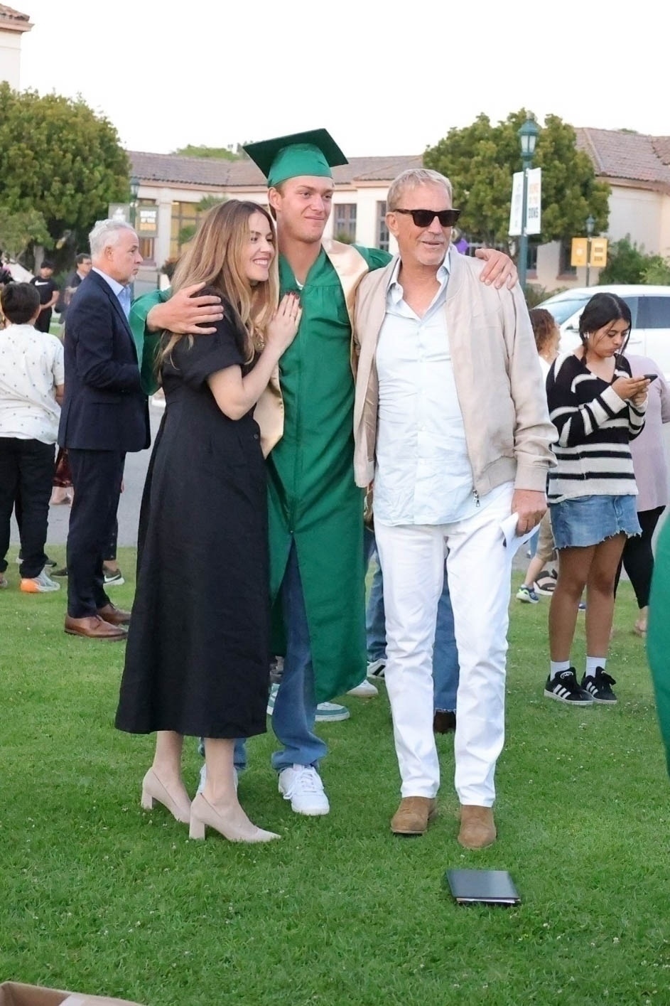 Kevin Costner, Lily Costner and his son Cayden at the teen's high school graduation.Kevin Costner and his son Cayden at the teen's high school graduation.
