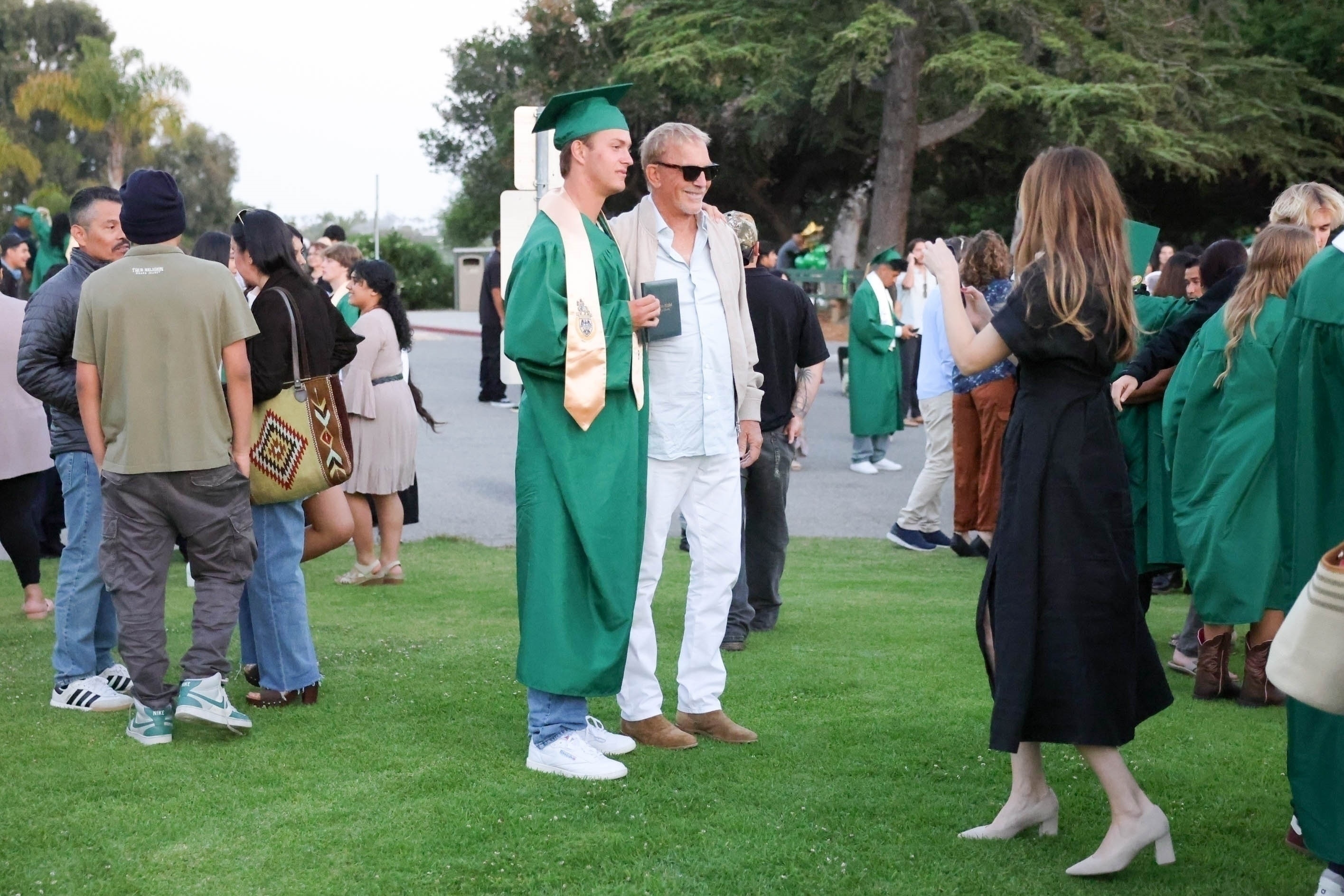 Kevin Costner and his son Cayden at the teen's high school graduation.