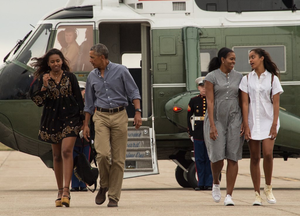 Michelle Obama, Barack Obama and their kids walk to board Air Force One at Cape Cod Air Force Station in Massachusetts on Aug. 21, 2016