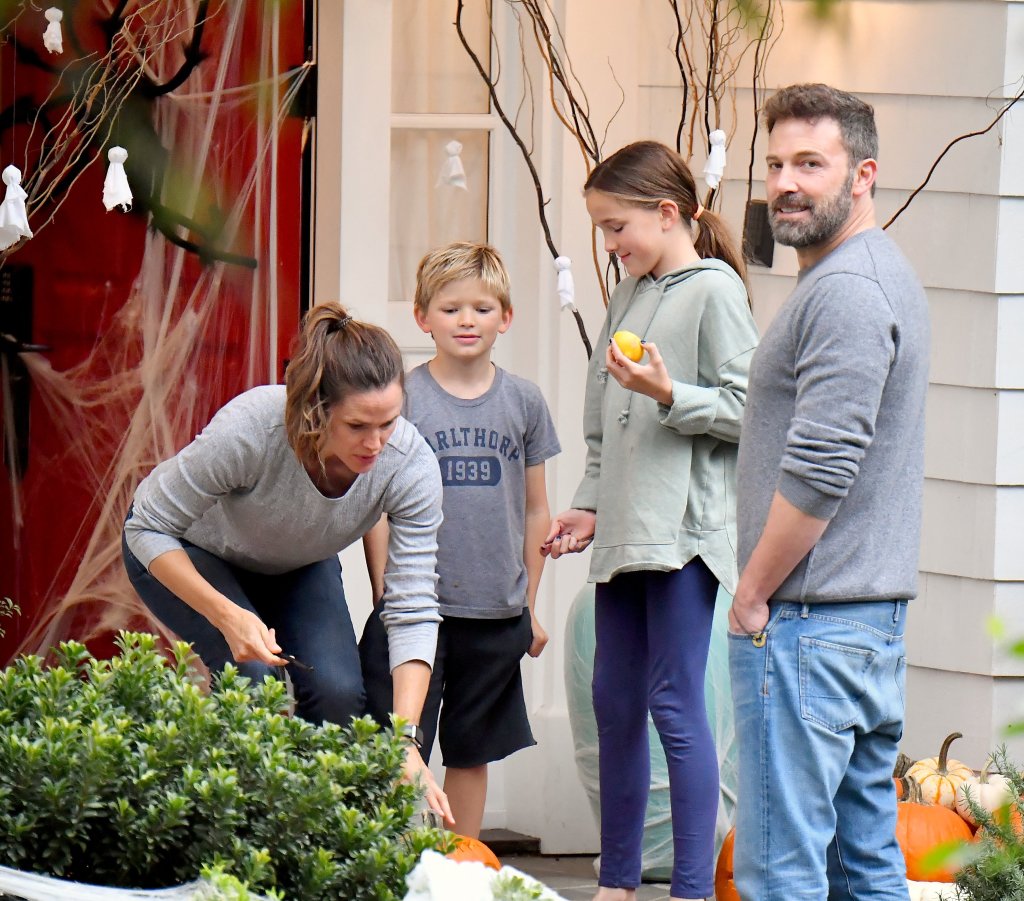 Ben Affleck and Jennifer Garner put up a united front for their kids as they light a Jack-o-lantern together in October 2019