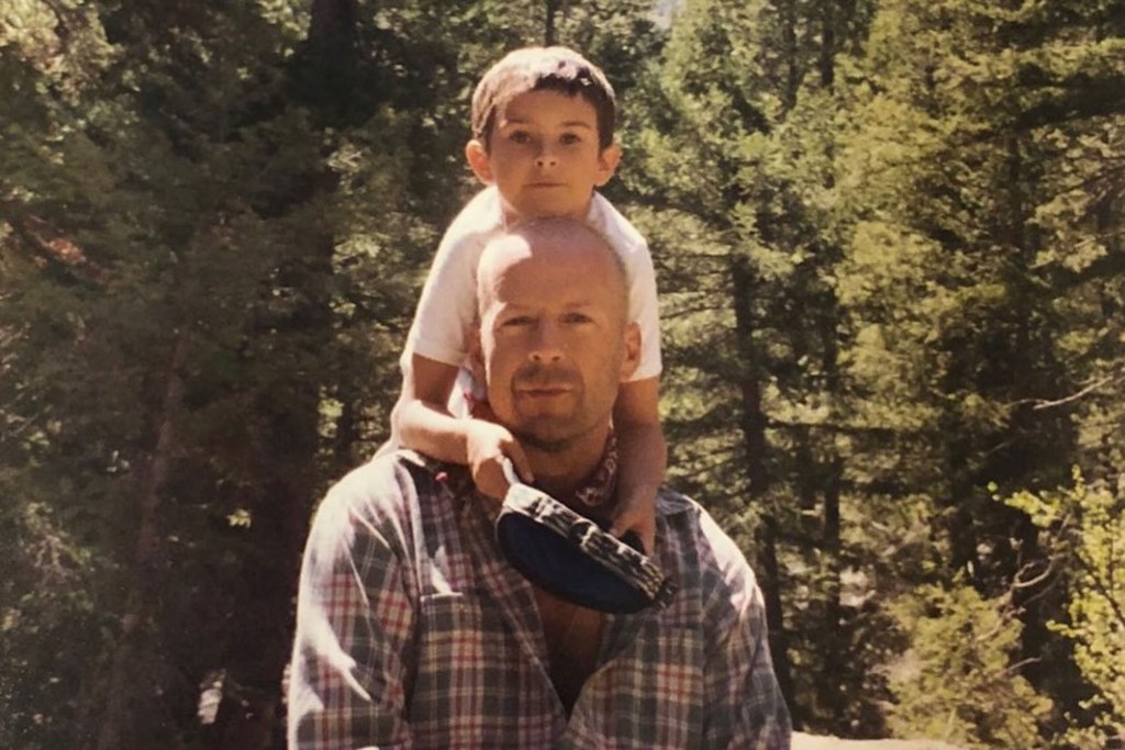 Rumer Willis poses with her father Bruce Willis as a child.