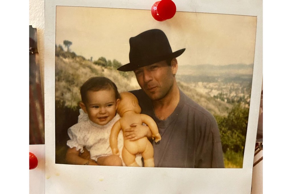 Rumer Willis poses with her father Bruce Willis as a child.