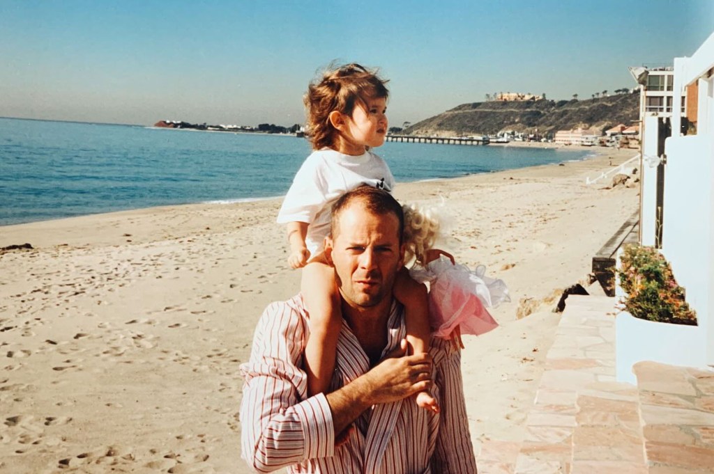 Rumer Willis poses with her father Bruce Willis as a child.