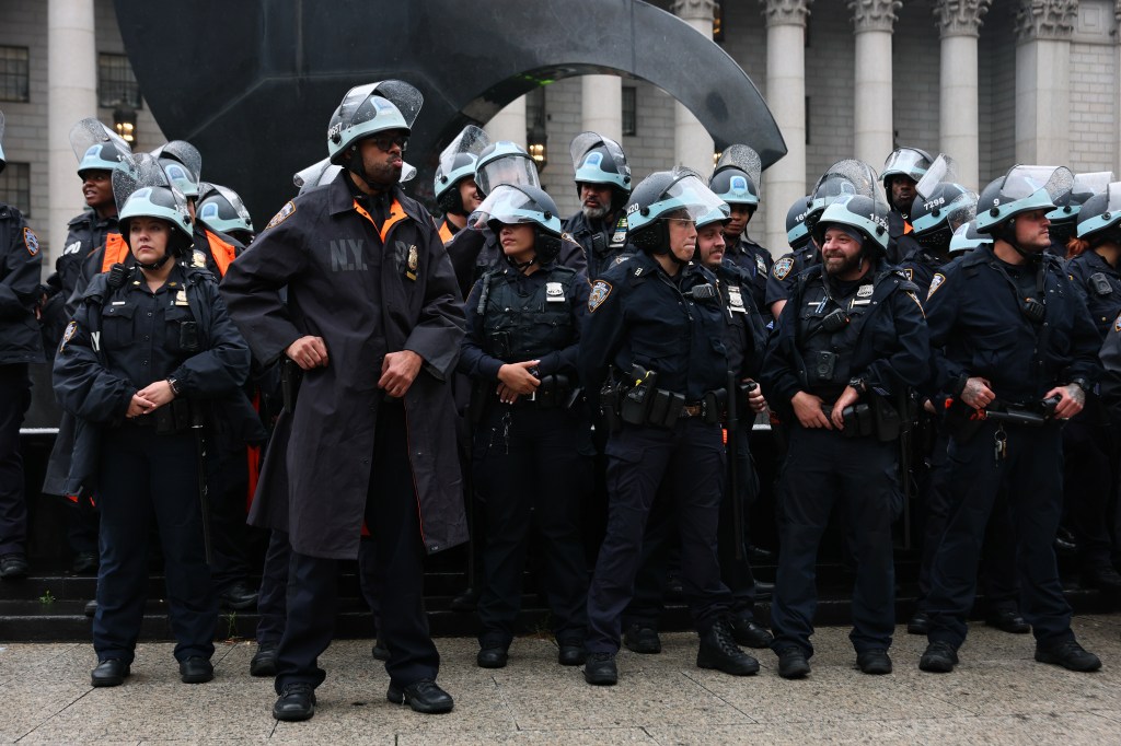 New York City police officers in riot gear at an anti-Trump protest.