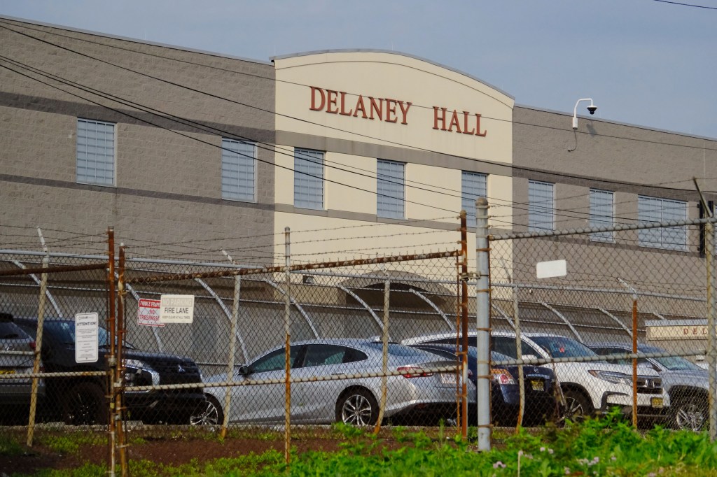 Delaney Hall Detention Facility behind a fence.