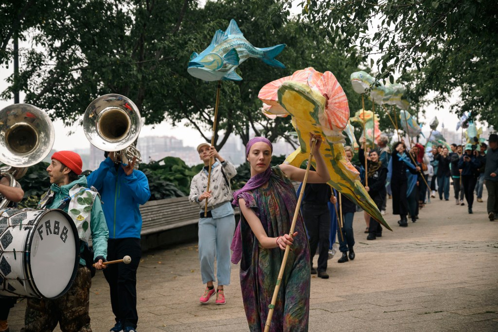 Marchers with paper-mache sturgeons and other fish.