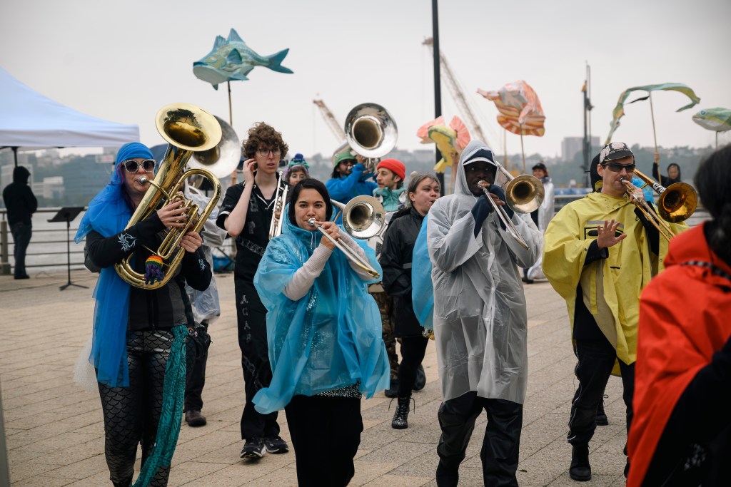 A marching band performing in the Fish Migration Celebration.