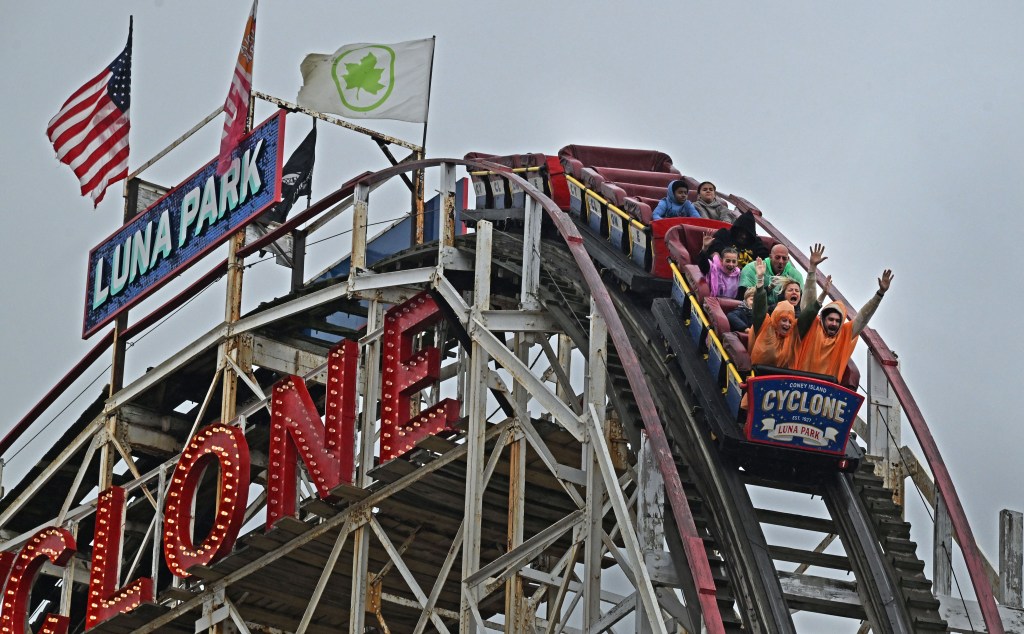 People riding the Cyclone roller coaster at Coney Island's Luna Park.