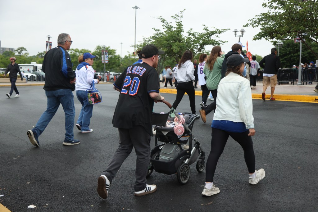 People walking near Citi Field on Father's Day.