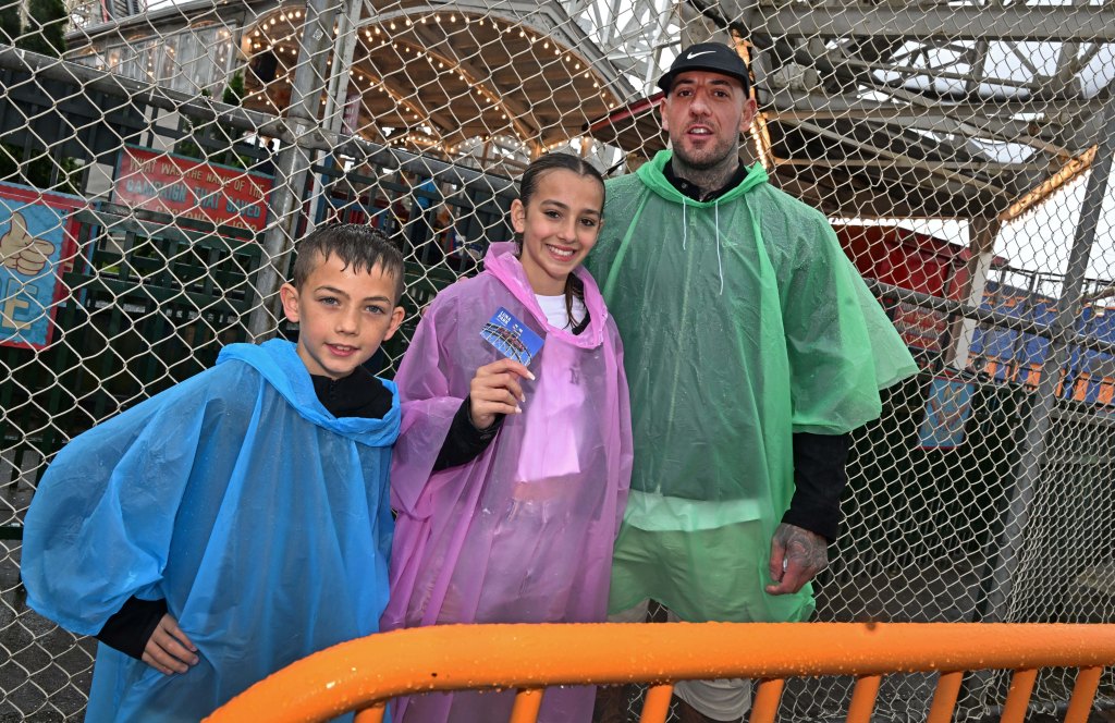 Family in rain ponchos at Coney Island.