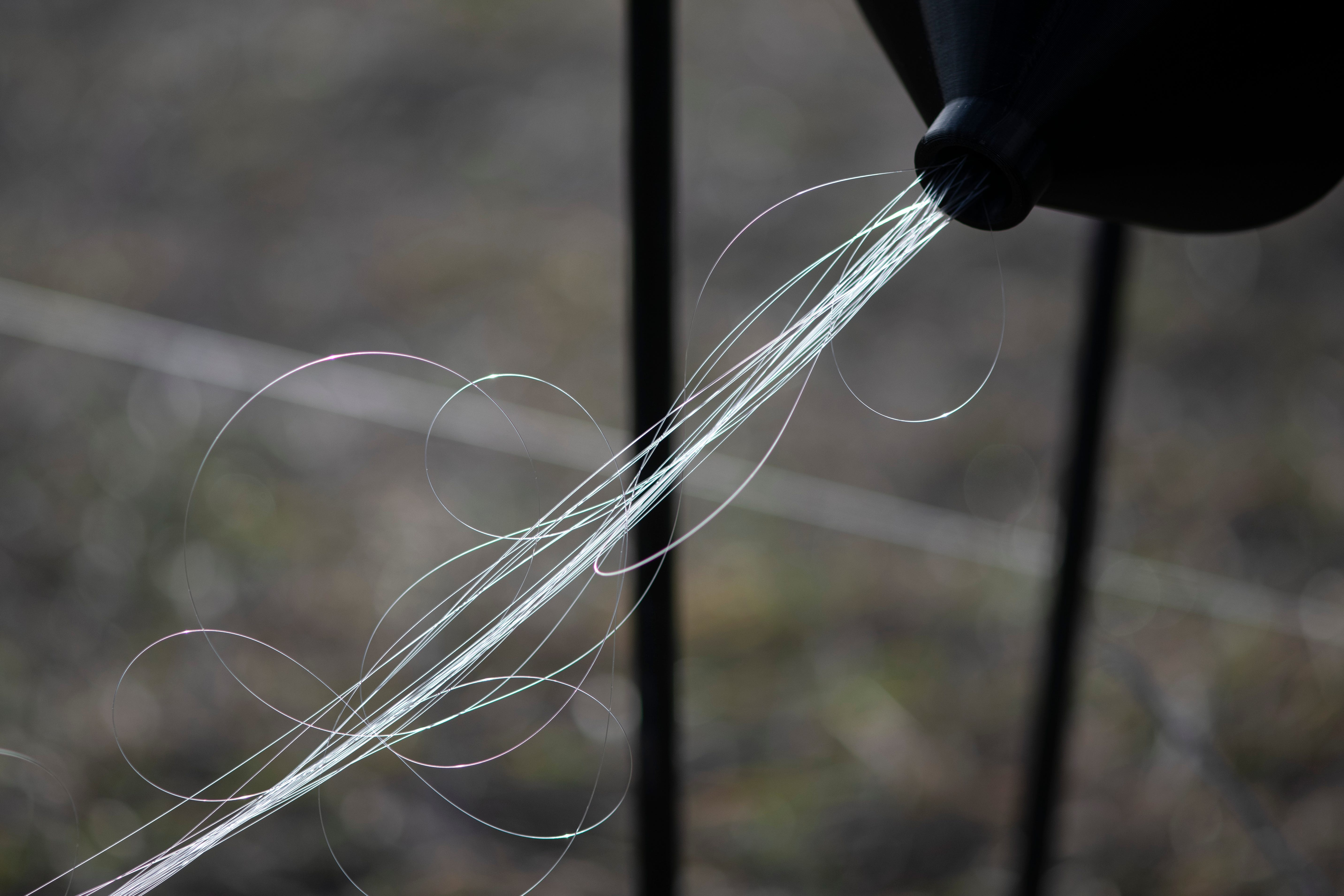 Fiber-optic wires can be seen connected to a drone during a test flight in the Kyiv region in December.