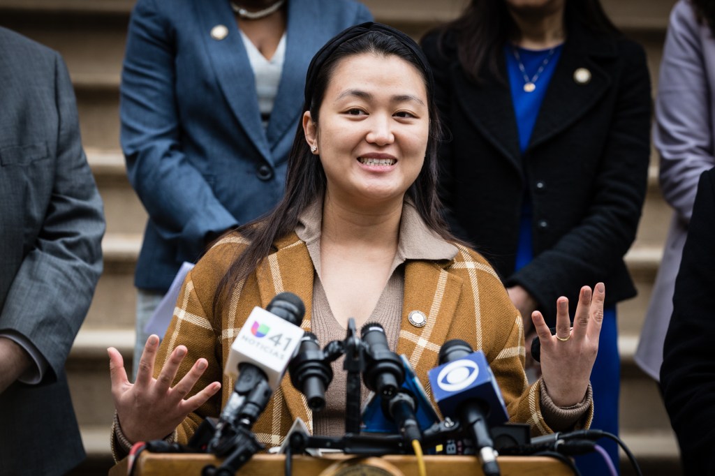 A woman speaking at a press conference.