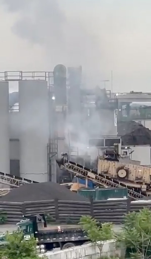 Smoke billowing from a recycling plant.