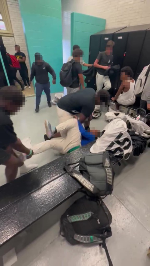 Pixelated image of teens assaulting another teen in a locker room.