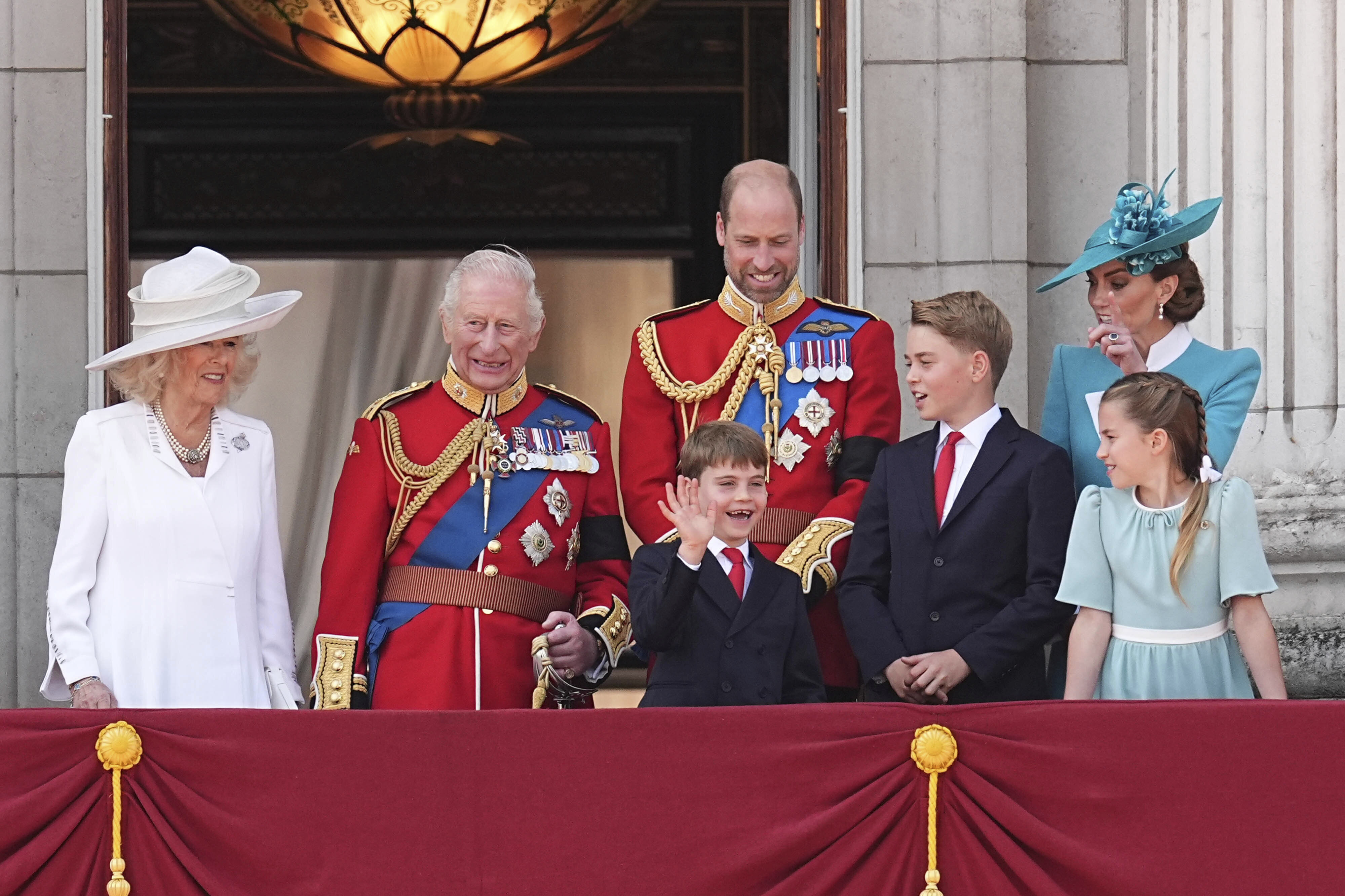 Queen Camilla, King Charles III, Prince Louis, Prince William, Prince George, Kate Middleton and Princess Charlotte watch an RAF flypast from the balcony of Buckingham Palace in 2025