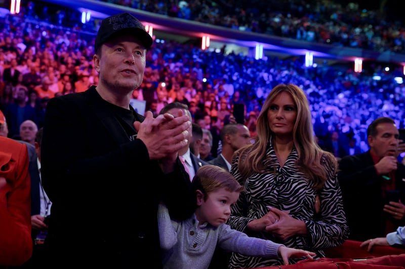 Tesla CEO and X owner Elon Musk and Melania Trump look on during a rally for Republican presidential nominee and former U.S. President Donald Trump at Madison Square Garden, in New York, U.S., October 27, 2024. REUTERS/Carlos Barria