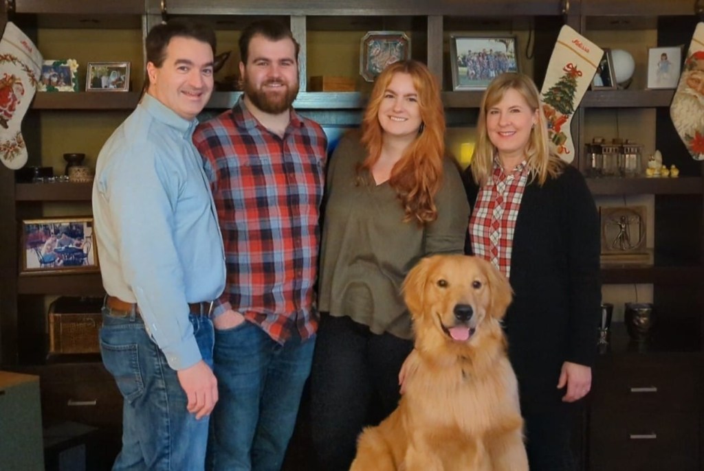 Family portrait with their dog.
