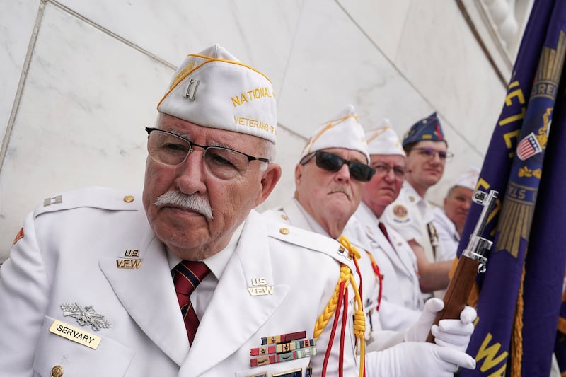 Veterans attend the annual National Memorial Day Observance in the Memorial Amphitheater at Arlington National Cemetery.