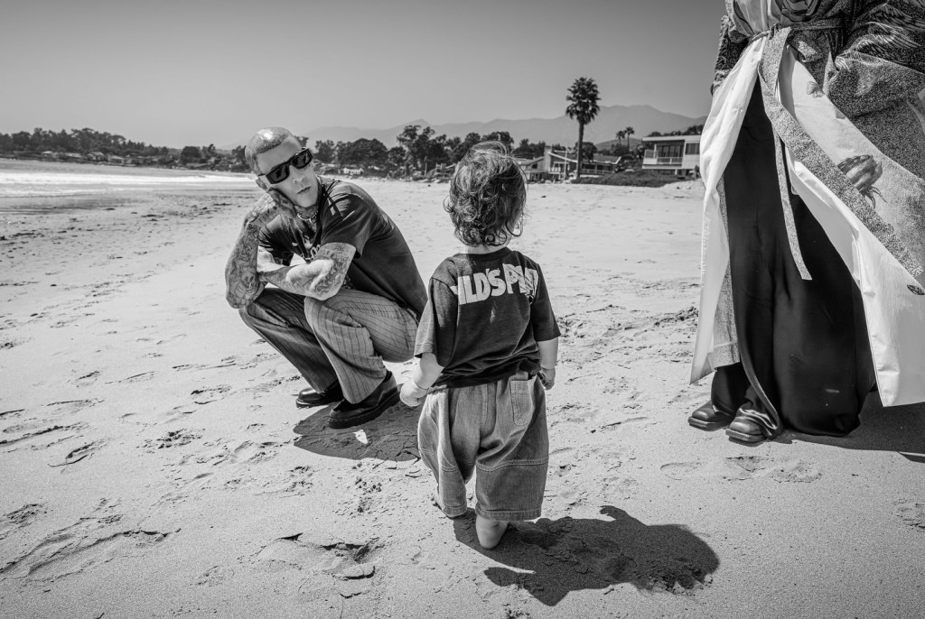 Kourtney Kardashian wishes husband Travis Barker a Happy Father's Day in a beach snap with their son Rocky.