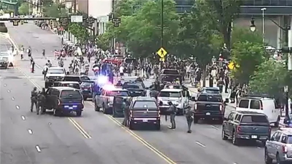 Police responding to a shooting during a protest.