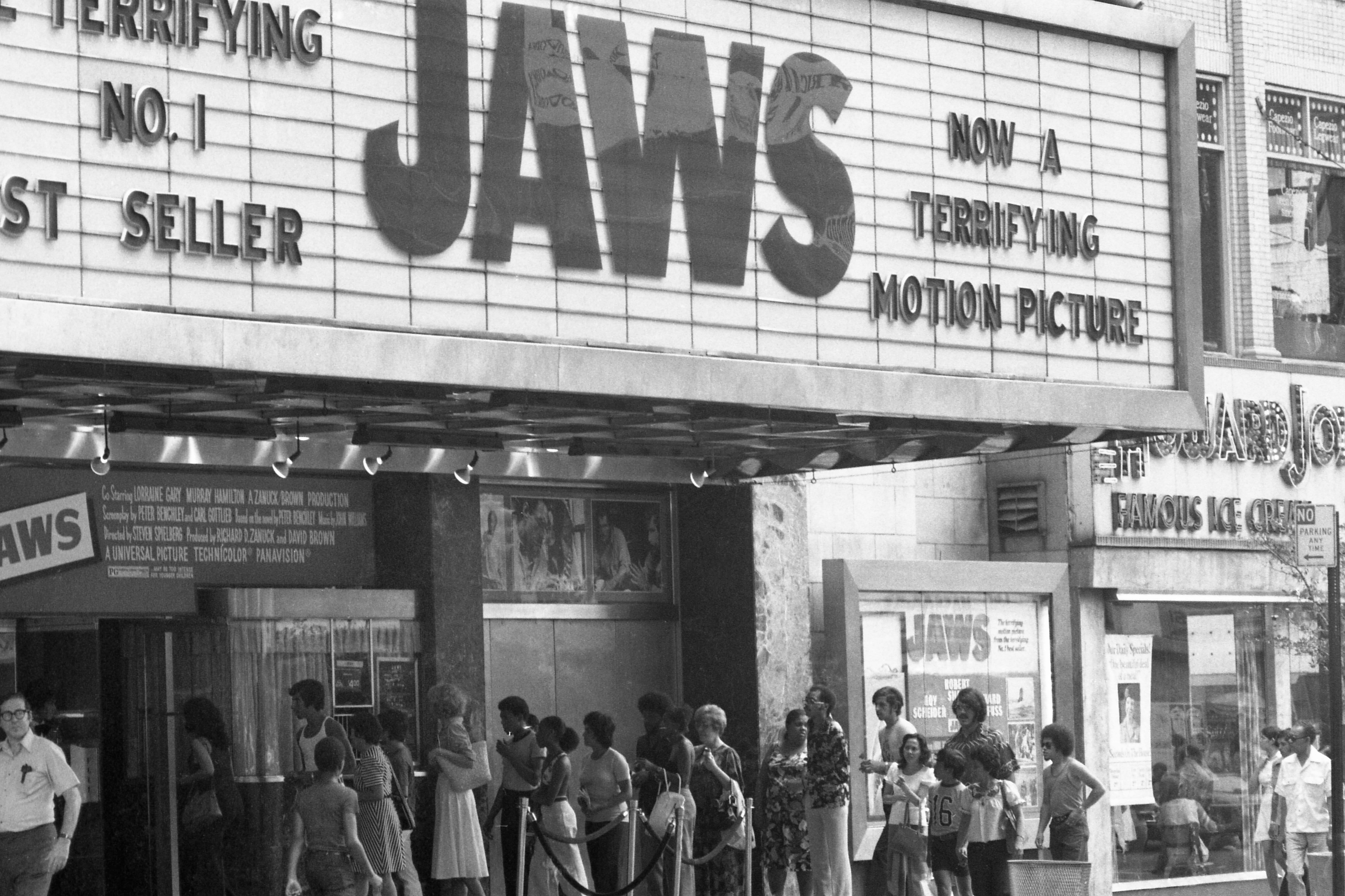 Crowds line up outside movie house to see "JAWS."