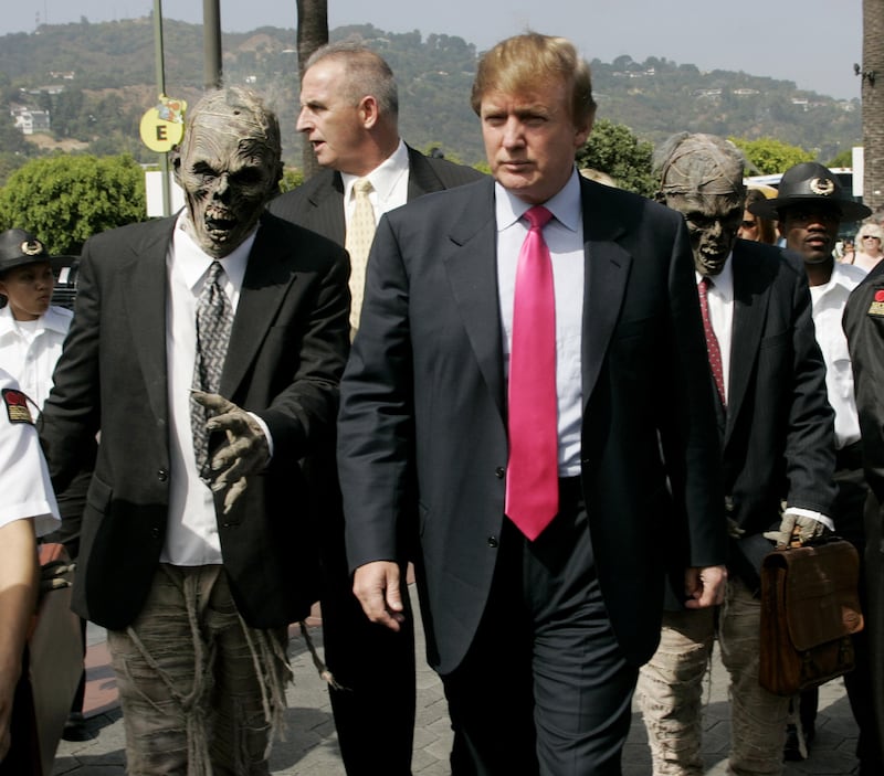 Donald Trump and a man dressed as a mummy