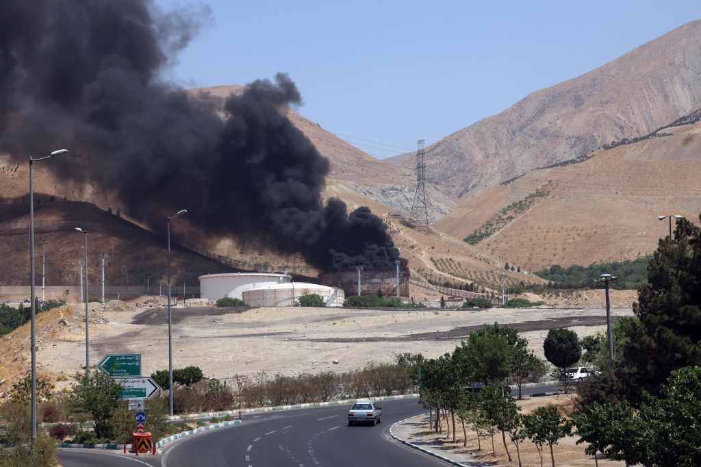 Smoke rising from an oil refinery fire near Tehran, Iran.