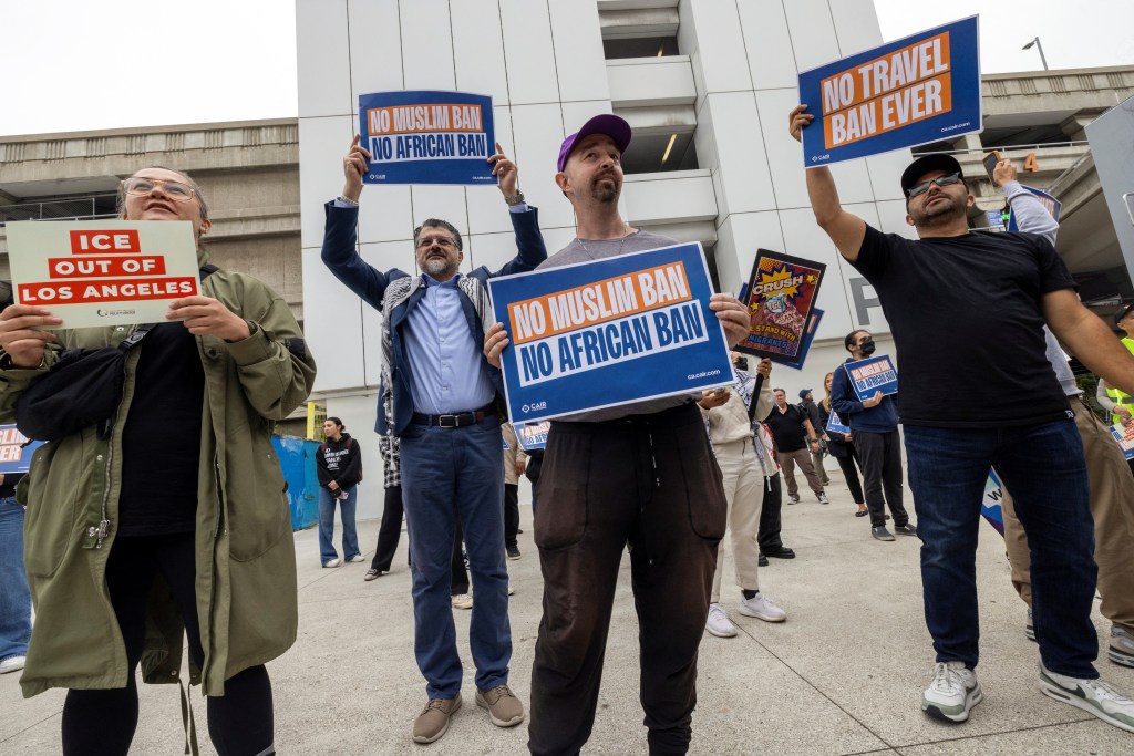 People take part in a protest sponsored by the Council on American Islamic Relations (CAIR) against President Donald Trump's new sweeping travel ban, which went into effect as his administration intensifies its immigration crackdown, at Los Angeles International Airport (LAX) in Los Angeles, California, U.S., June 9, 2025.