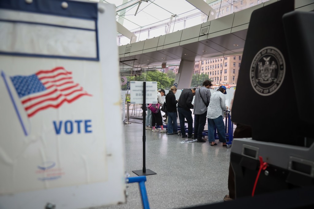 People voting early at a polling station.