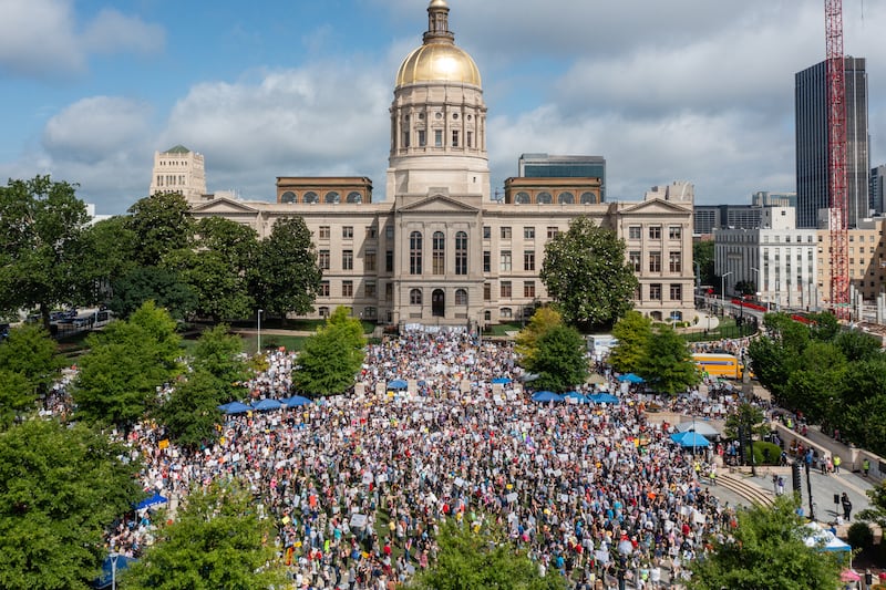 People take part in the "No Kings" protest at Liberty Plaza in Atlanta, Georgia, on Saturday.