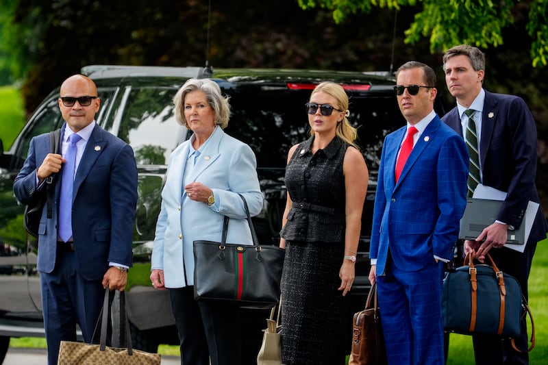 Aide Walt Nauta, White House Chief of Staff Susie Wiles, White House Press Secretary Karoline Leavitt standing with Sergio Gor on the South Lawn of the White House on May 1, 2025.