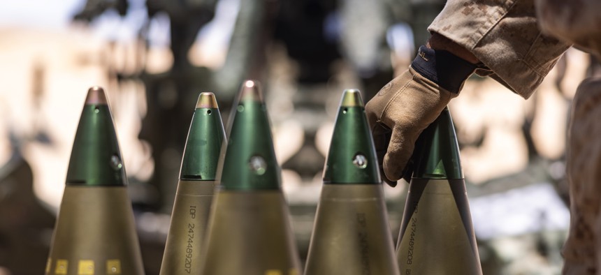 A cannoneer with the 4th Marine Division handles a 155mm shell during Integrated Training Exercise 3-25 at Marine Air Ground Combat Center, Twentynine Palms, California, on June 6, 2025.