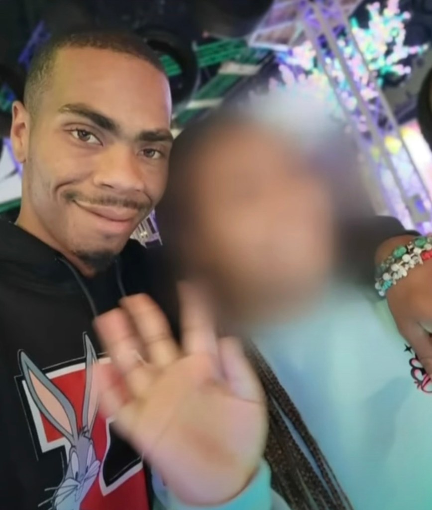 Photo of a man and a blurred child.