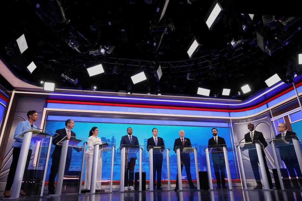 Democratic mayoral candidates Adrienne Adams, Brad Lander, Jessica Ramos, Zellnor Myrie, Andrew Cuomo, Whitney Tilson, Zohran Mamdani, Michael Blake and Scott Stringer take the stage before the primary debate on June 4, 2025.
