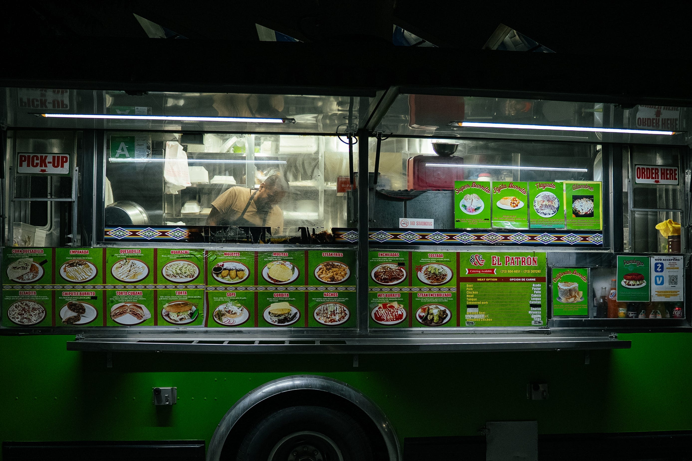 A koreatown food truck is parked on the street.