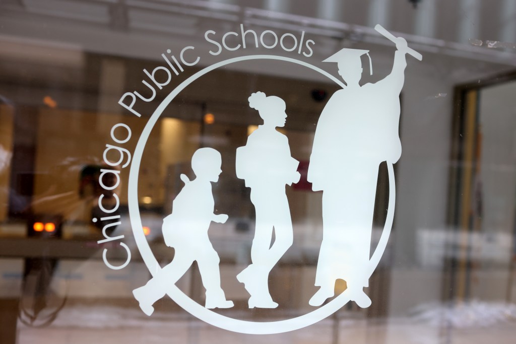 Chicago Public Schools logo on a window.