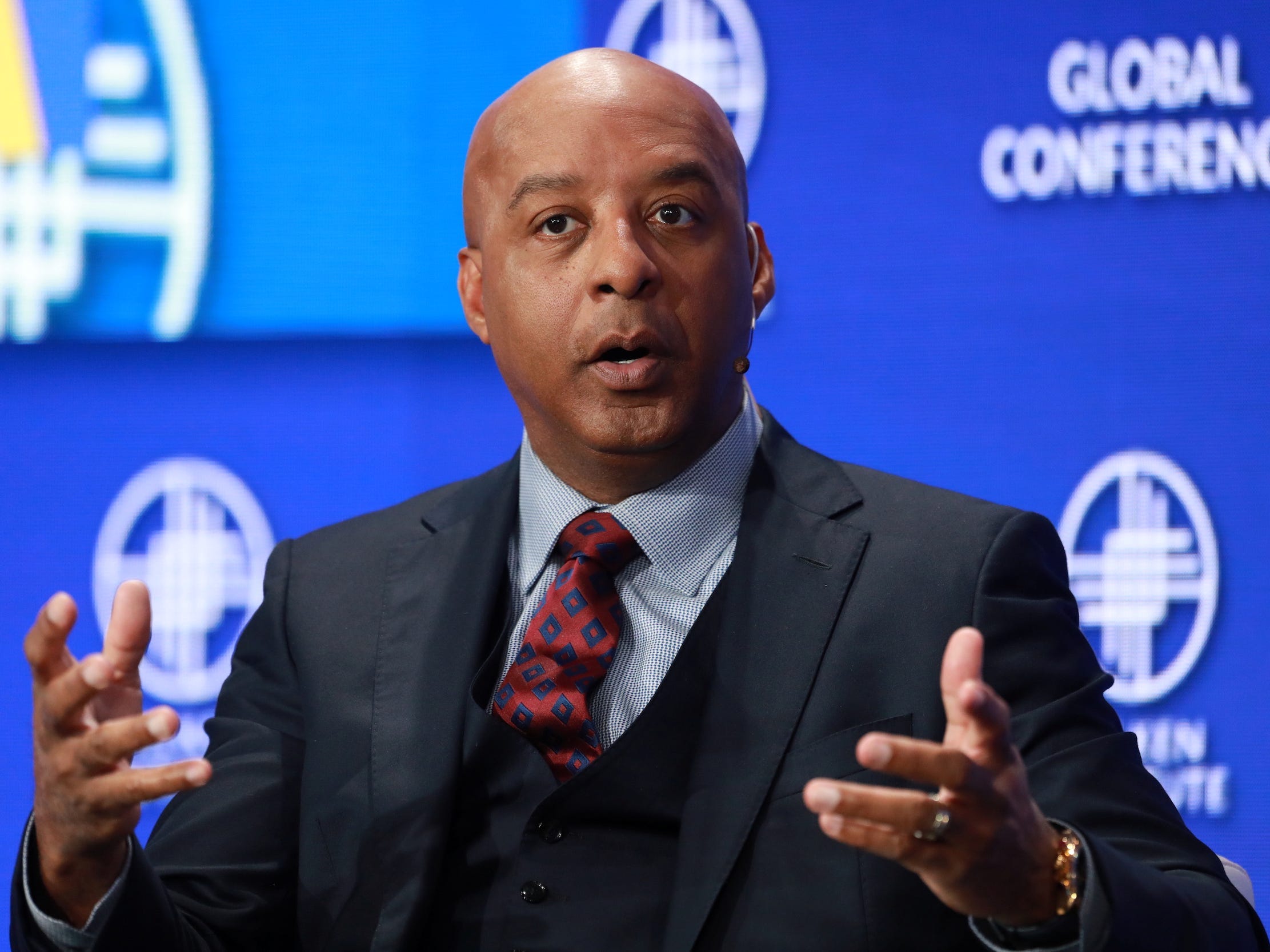 Lowe's CEO Marvin Ellison gestures while sitting on stage at conference