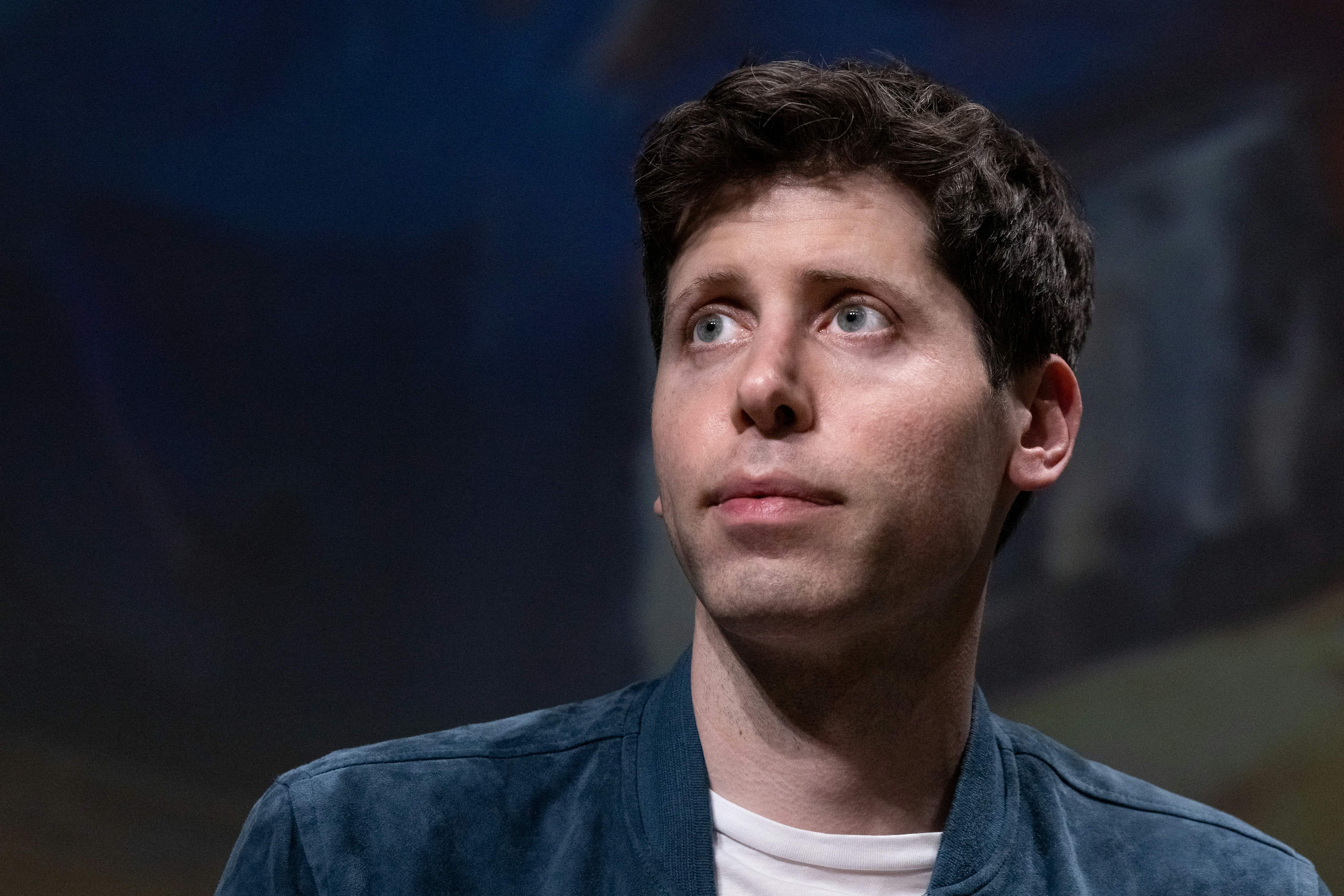 Sam Altman looking at something in the distance.