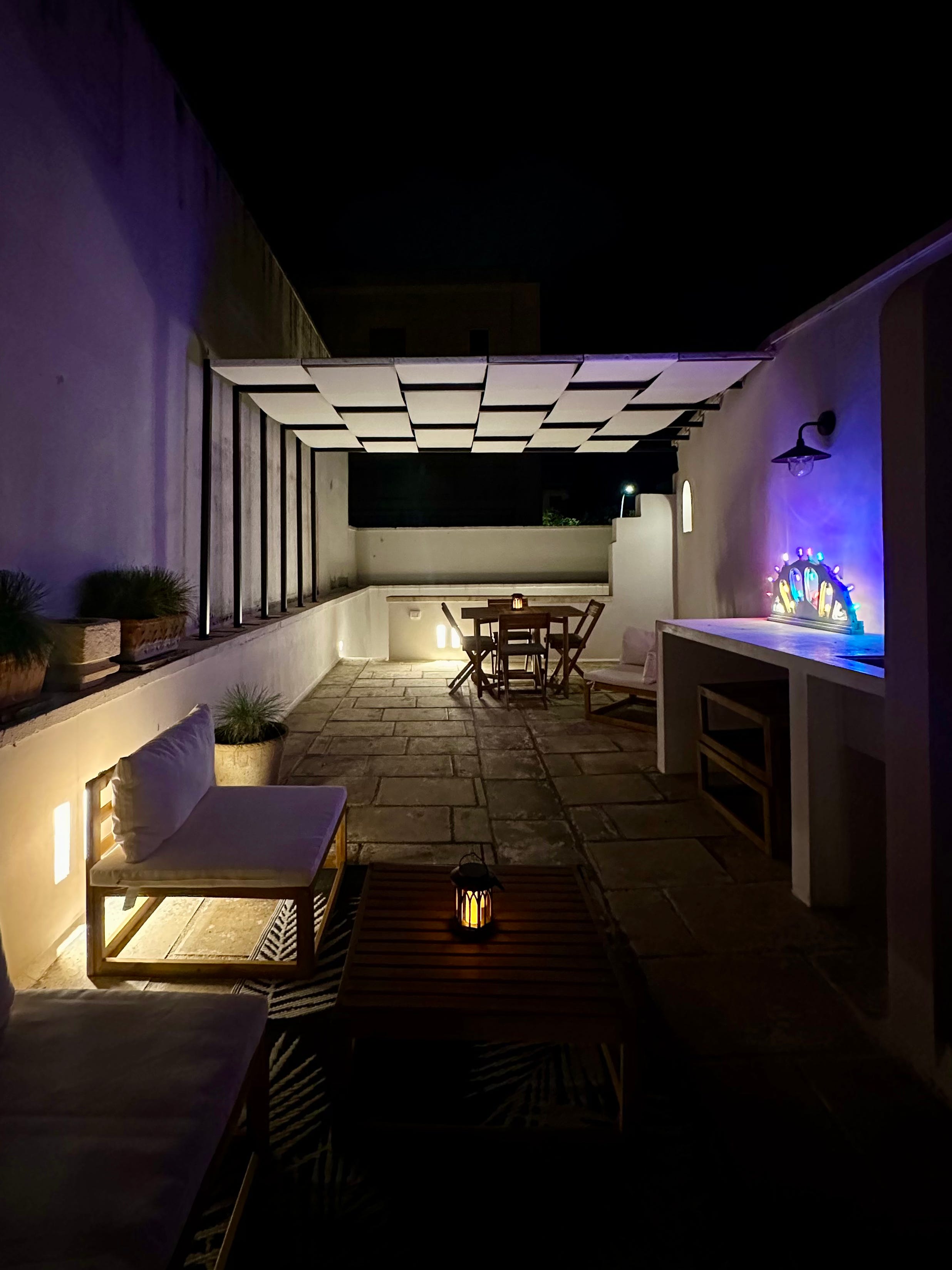 An outdoor patio in Italy in the evening.