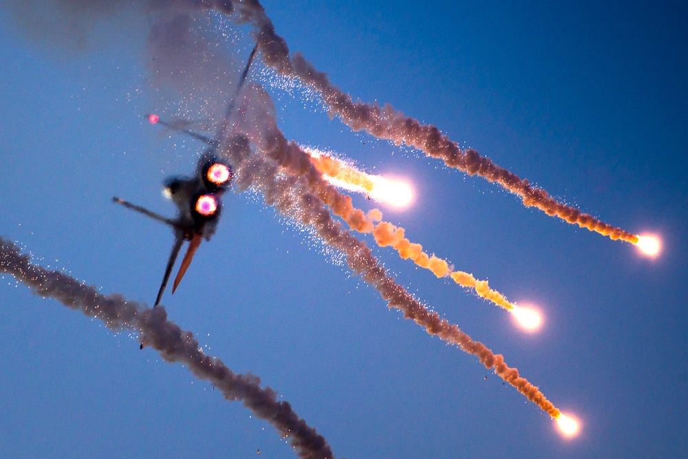 An F-15I fighter jet deploys weapons.