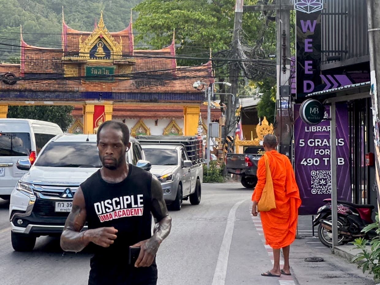 A man jogging on the streets in Koh Samui, Thailand.