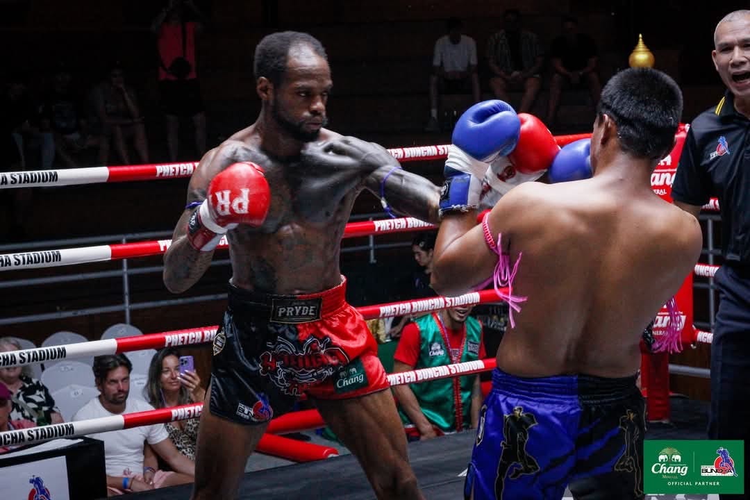 Two men fighting in a Muay Thai match in Koh Samui, Thailand.