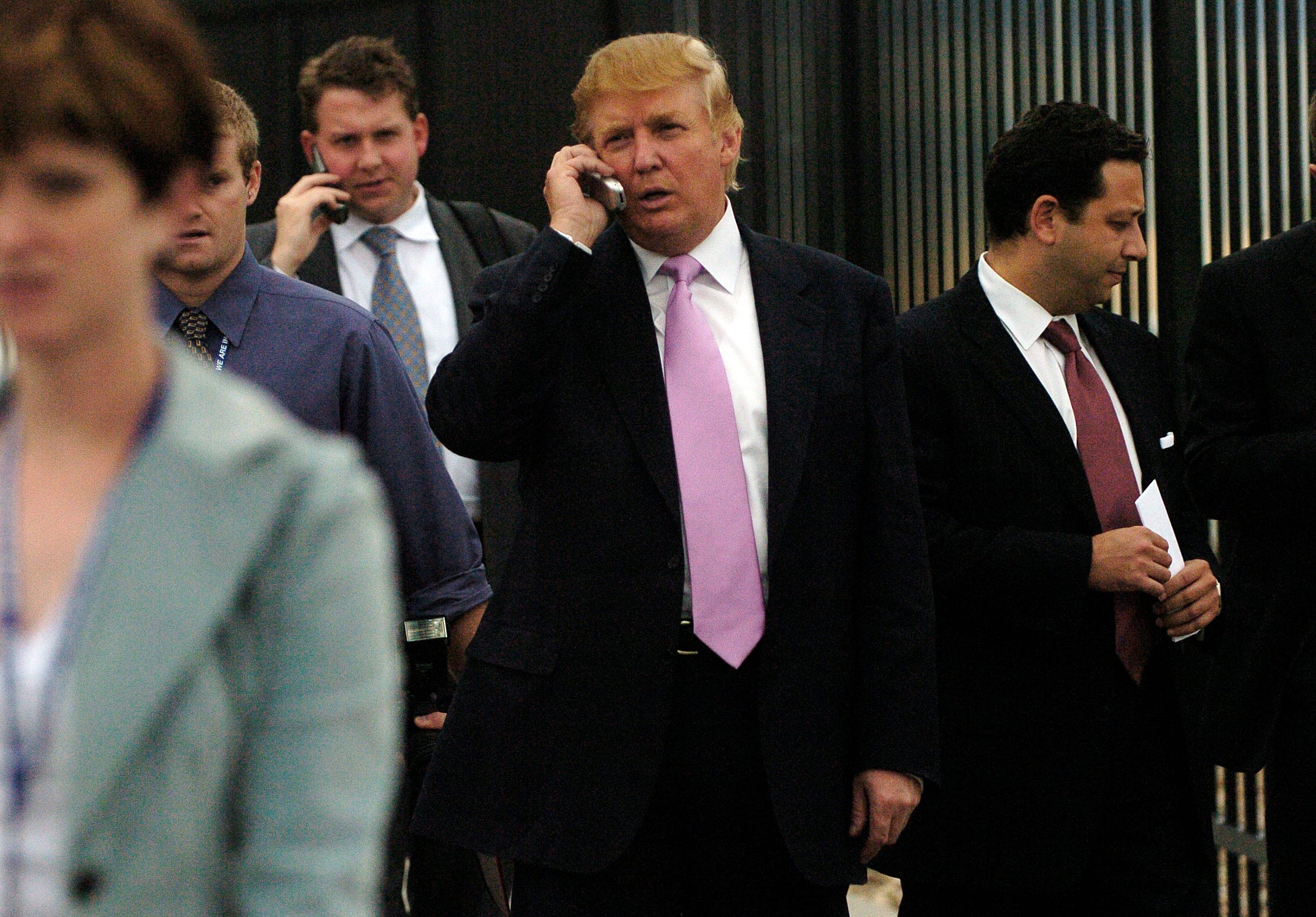 Donald Trump talks on a flip phone in 2005.