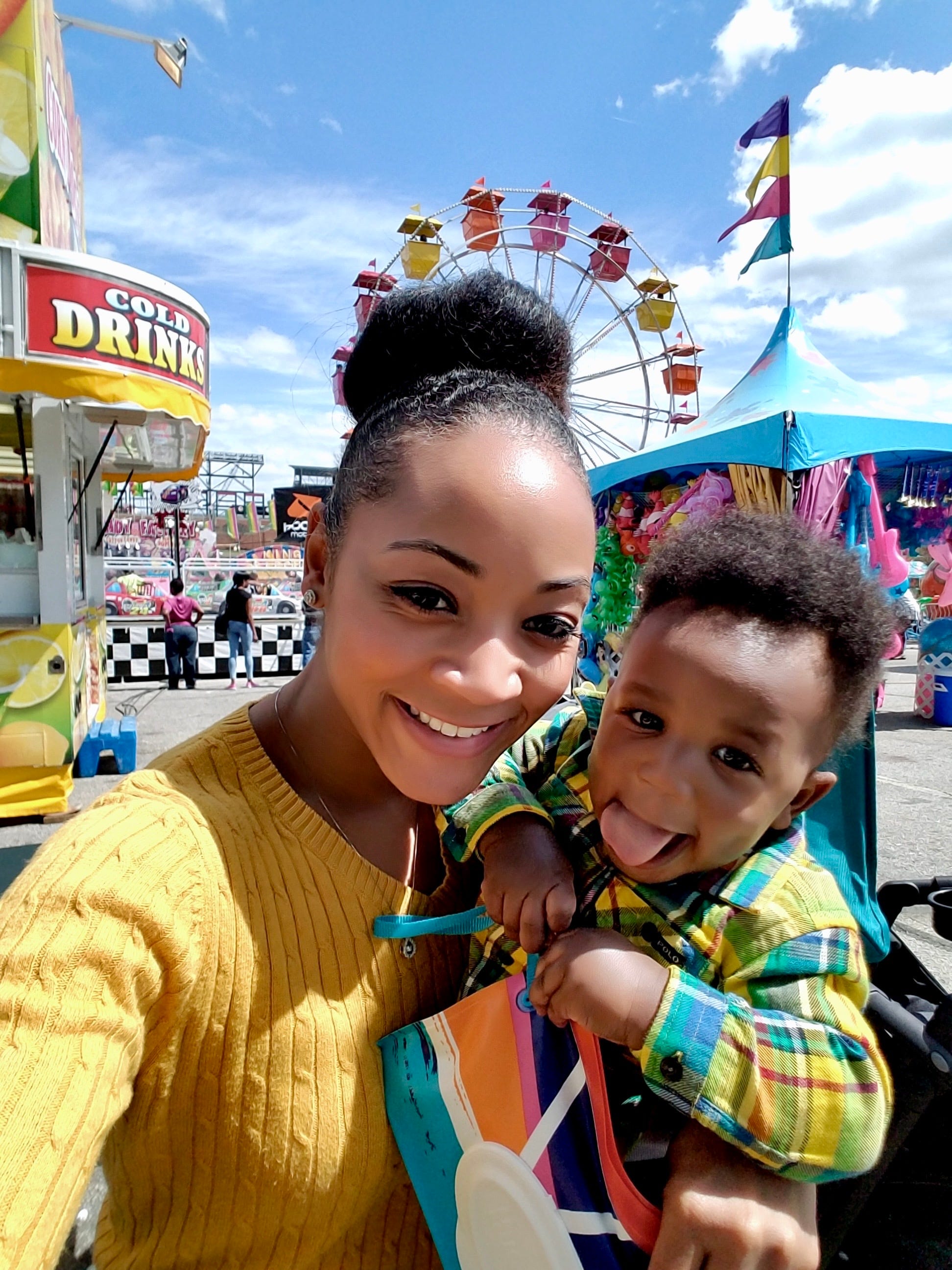 A selfie of Jenna Scott and her son at a funfair.