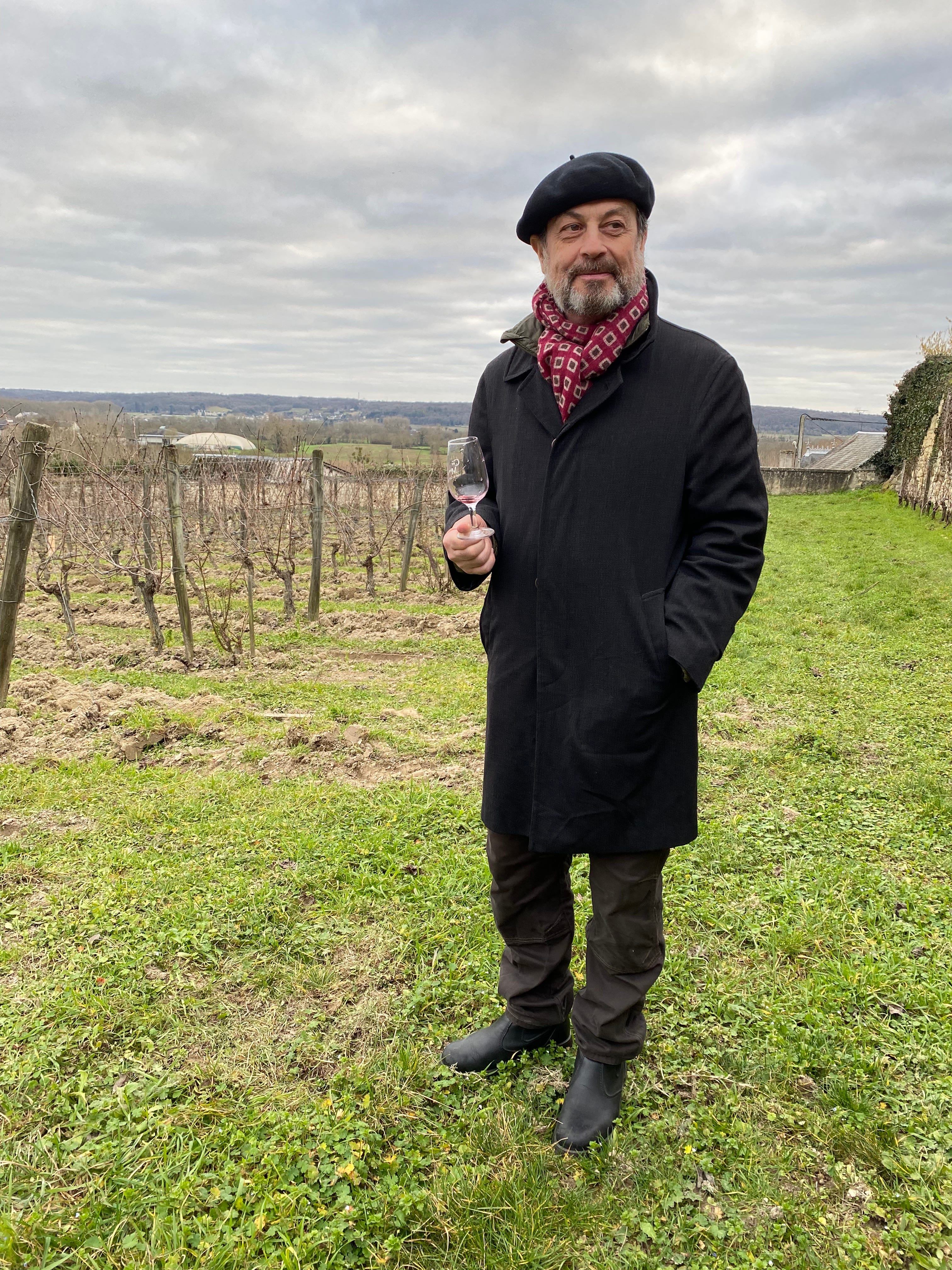 Victor Schwartz at a vineyard holding a wine class.