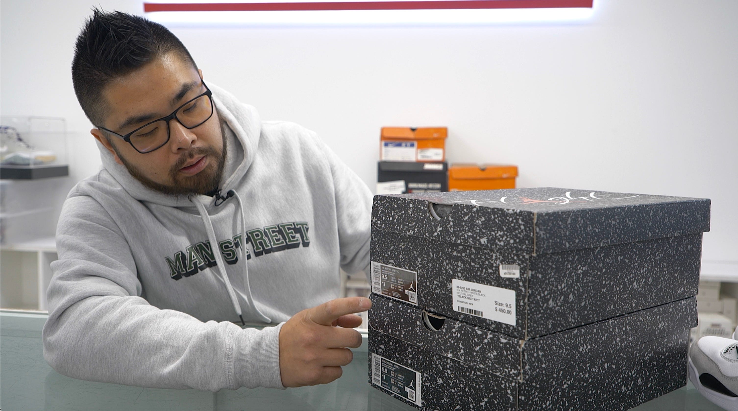 Shu Cheng inspecting shoe boxes