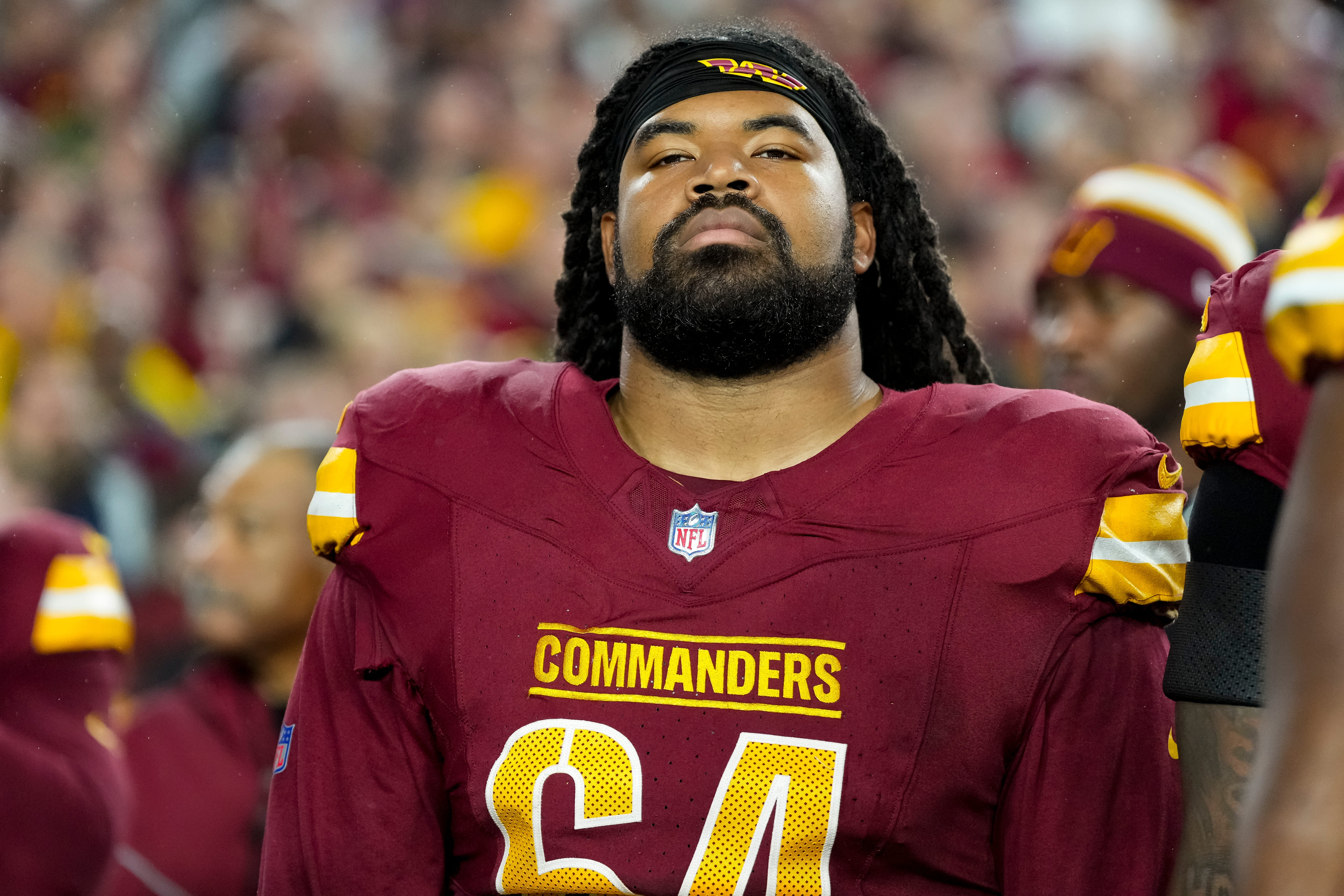 NFL player Sheldon Day standing on the sideline.