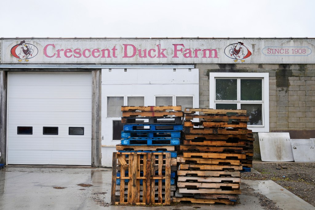 Crescent Duck Farm building with pallets in front.