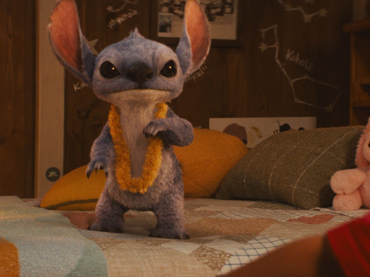 A still from "Lilo & Stitch" showing a blue alien in a bedroom.