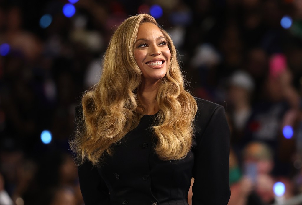 Beyoncé smiling at Kamala Harris' Houston rally in 2024. 
